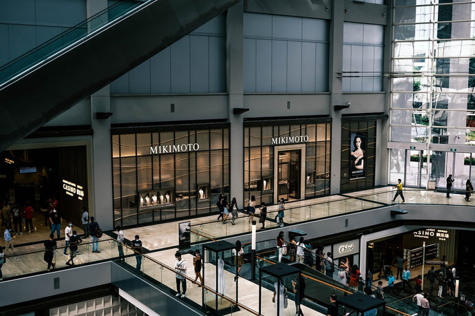 People are shopping in the fancy mall.