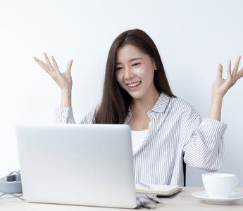 Retail business owner monitoring omnichannel business performance on a laptop from home.